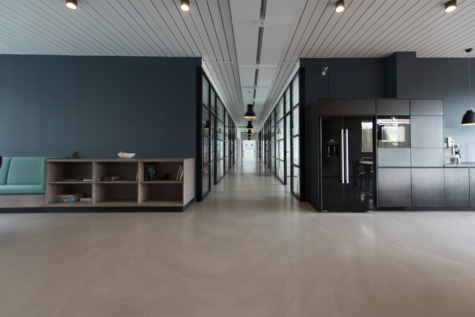 An executive reviewing strategy documents in a minimalist boardroom