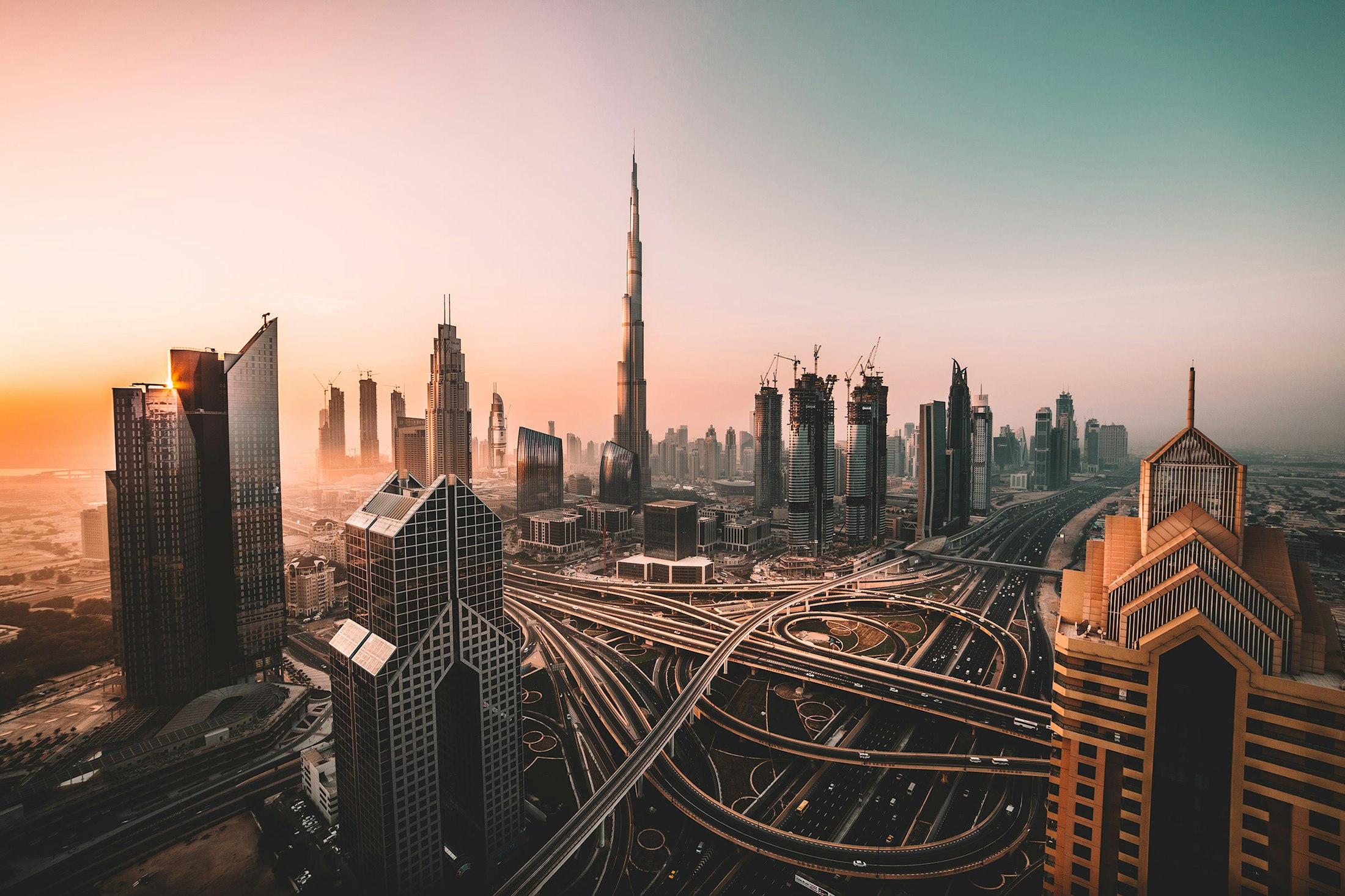 A world-class financial district skyline at dusk with warm interior lighting